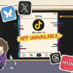 Construction-paper cartoon: a giant cardboard smartphone laid horizontally with the TikTok app showing 'APP UNAVAILABLE' in red marker across a glitched screen (RGB-shift edges in cyan and magenta, scanlines, RECORDING dot in upper-right). Around the phone: paper-cutout app icons for Bluesky, X/Twitter, Lemon8, RedNote scattered like fallen cards. In the lower-left: lil_glitch_69, a Gen Z teen with messy chin-length hair in an oversized purple hoodie with the hood up, hugging their knees, surrounded by paper teardrops. Background: a messy paper bedroom corner with an unmade bed and a torn TikToker poster. Reported by lil_glitch_69.