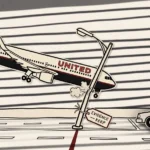 A noir paper-cutout reenactment: a cardboard Boeing 767 in United livery descends diagonally over a paper New Jersey Turnpike, its starboard wing-tip clipping a single paper light pole that has bent at the impact point. A small paper EVIDENCE—KEEP tag is tied to the pole. A paper sedan sits to the right with its driver staring up jaw-dropped. Hard horizontal noir blinds-shadows in marker stripe across the entire scene — construction-paper cutout cartoon